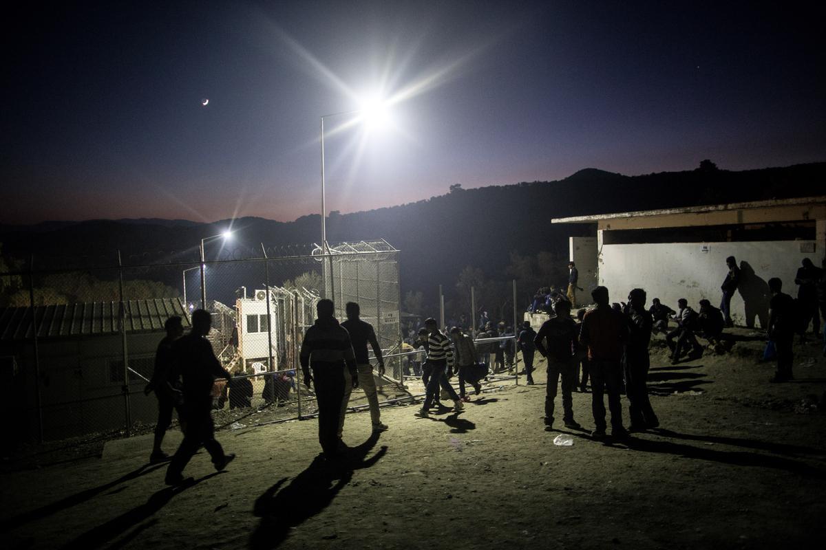Migrants from Pakistan and Afghanistan waiting outside of the registration camp in Moria, Lesbos on October 14, 2015.