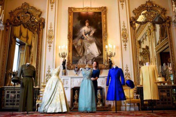 Exhibition curator Caroline de Guitar poses for photographers as she shows off a preview of an exhibition entitled 'Fashioning a Reign: 90 Years of Style from The Queen's Wardrobe,' charting the reign of Britain's Queen Elizabeth through a display of her formal and informal outfits, at Buckingham Palace, in central London, Britain July 4, 2016. REUTERS/Dylan Martinez