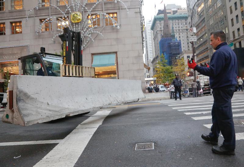 Concrete barriers arrive for placement around Trump Tower, Wednesday Nov. 9, 2016, in New York. (AP Photo/Bebeto Matthews)